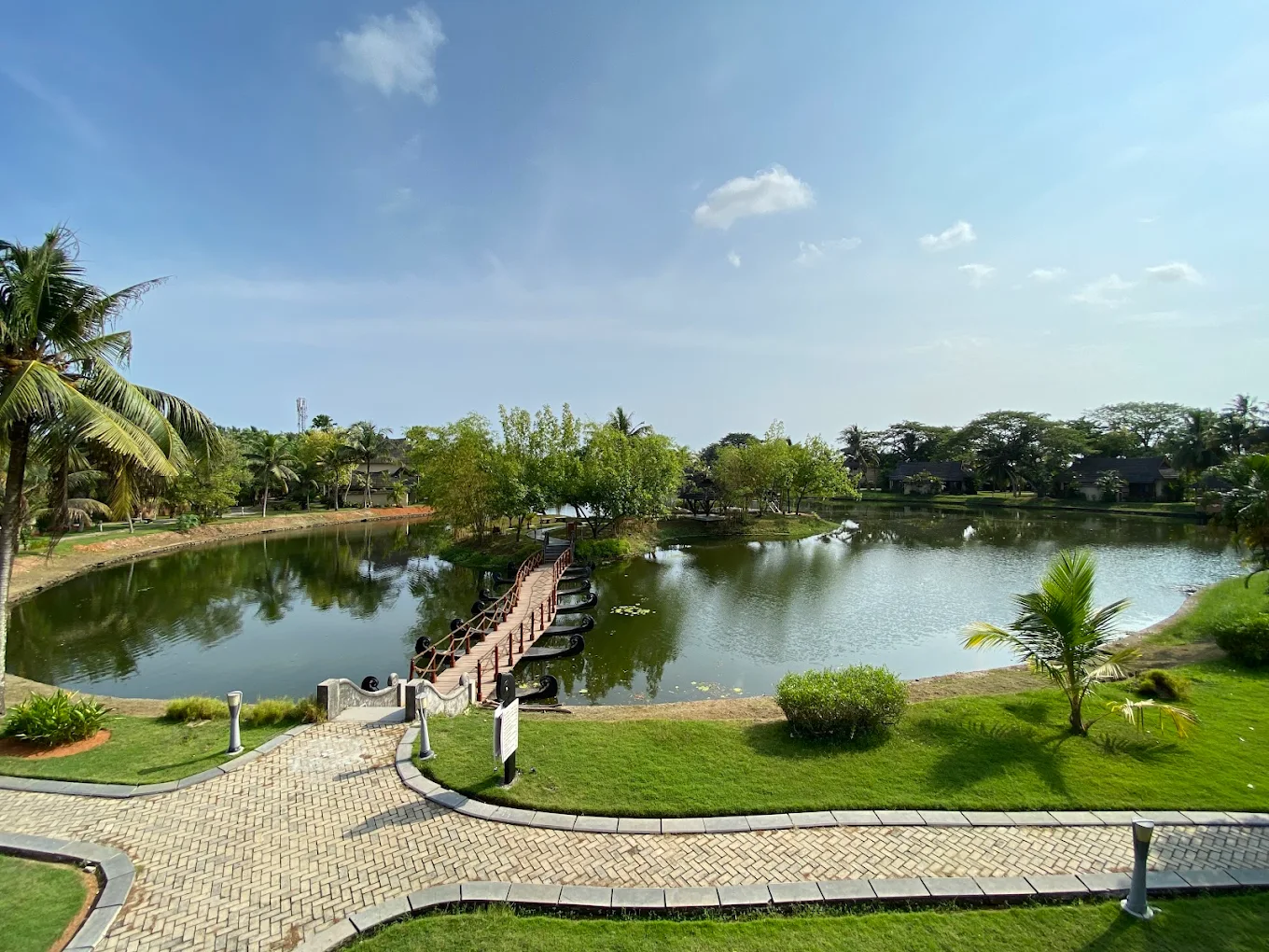 Lush landscaped resort grounds and water feature in Kumarakom Kerala